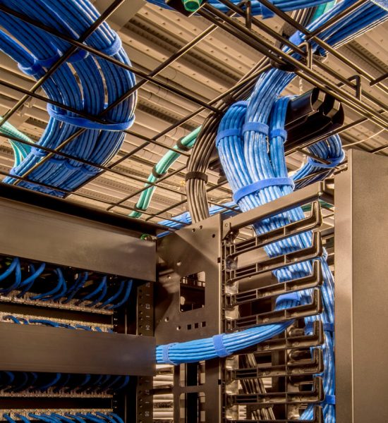 Neatly organized cables in a data center.