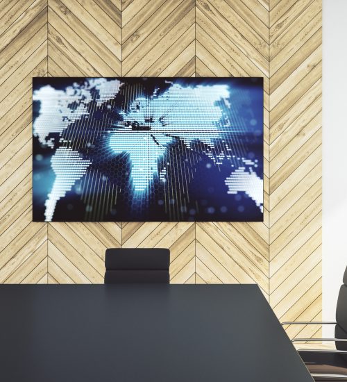 A large digital display in a conference room.