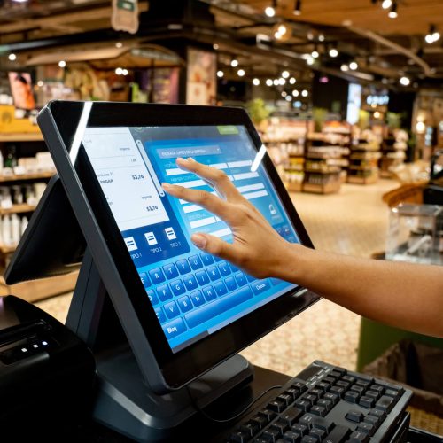 A worker using a digital point of sale device