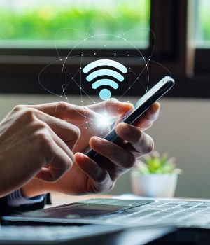 A digital rendering of a wireless network with glowing nodes connected by lines, symbolizing data flow on a dark blue background.